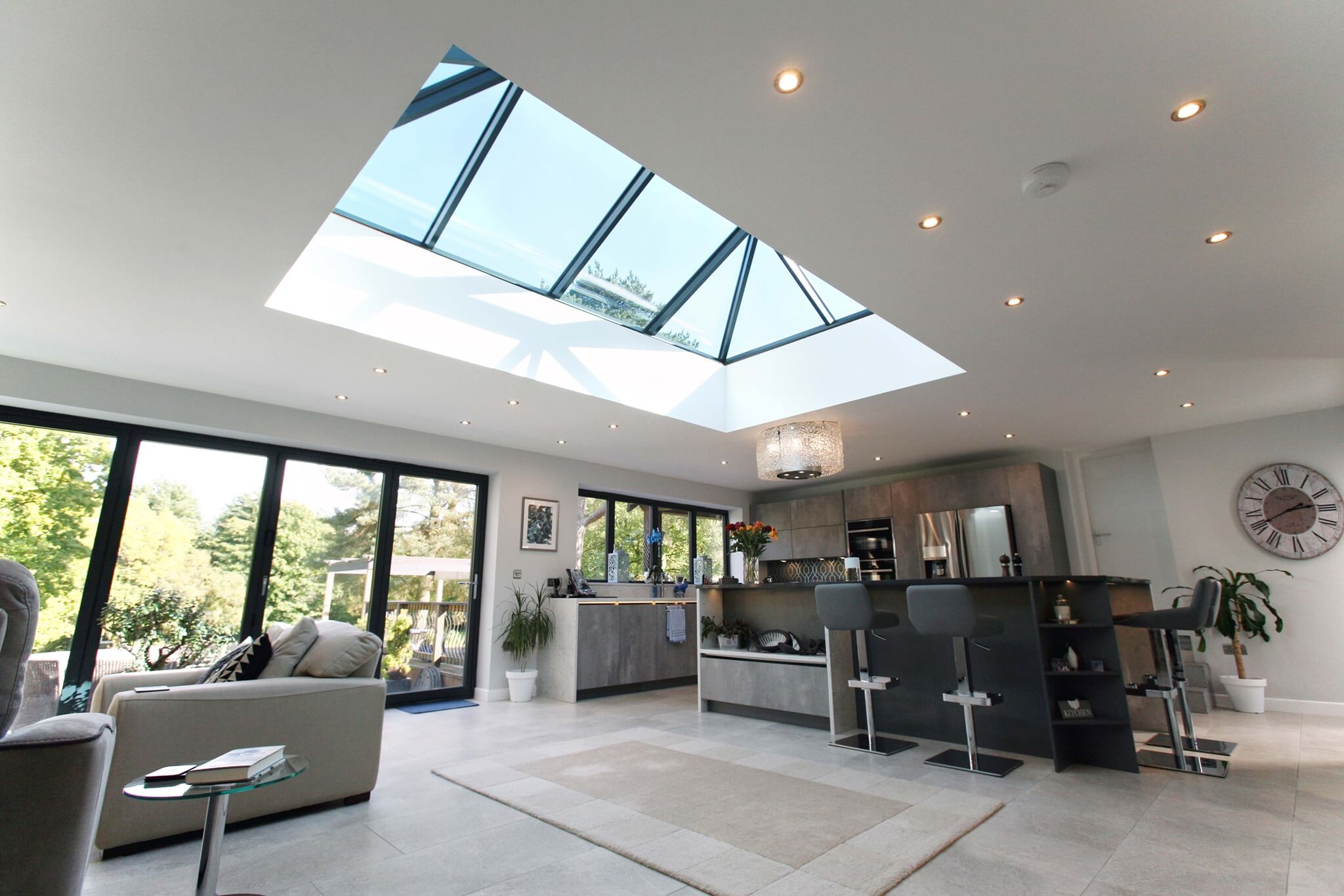 REAL Ali Glazed Extension with Lantern Roof and black ali sliding door Kitchen living room