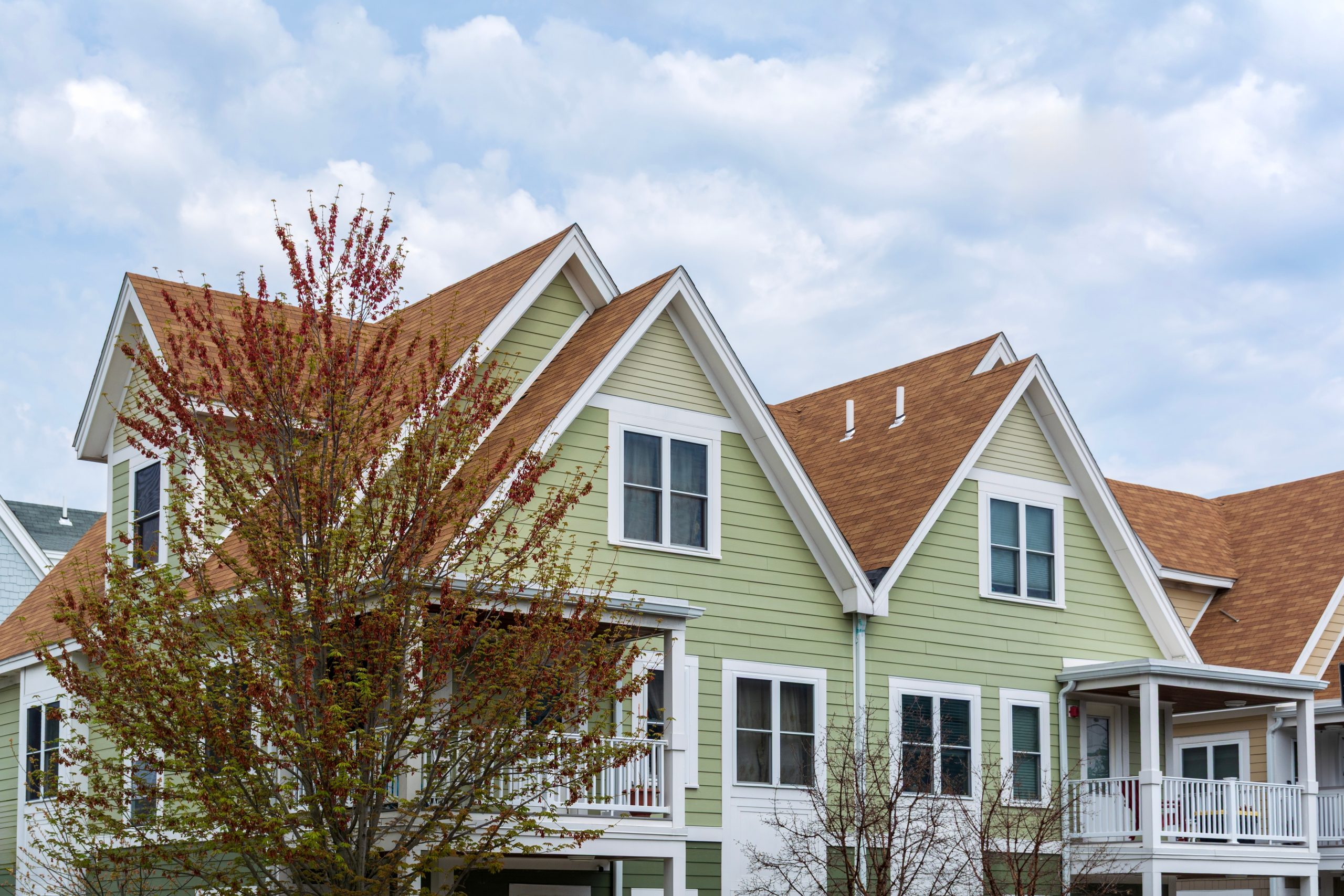 Upper,Facades,Of,Charming,Multi-unit,Homes,With,Composite,Roofing,